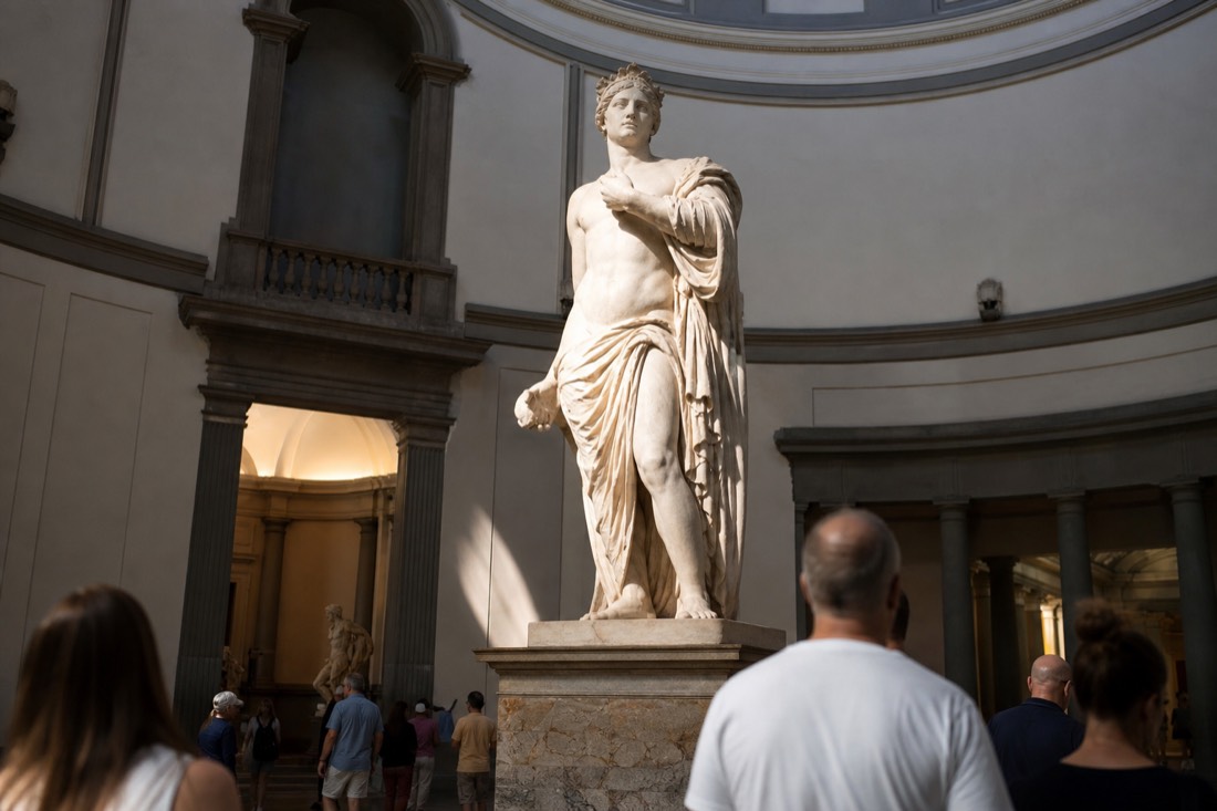 Michelangelo's original marble David lit by the skylight of the Tribune inside the Accademia Gallery in Florence