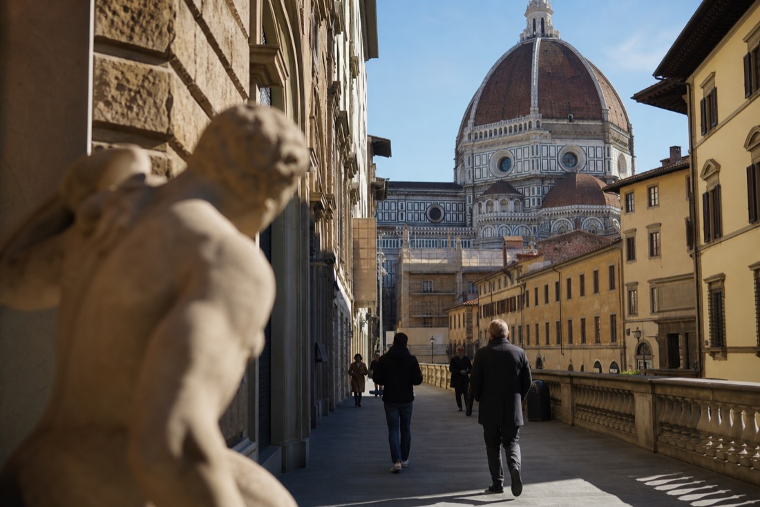 Winter afternoon light on the Duomo and quiet Florence streets seen from near the Accademia Gallery with few tourists about