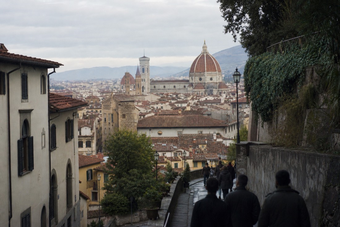 Early morning view over Florence rooftops toward the Duomo with quiet streets before the tourist crowds arrive