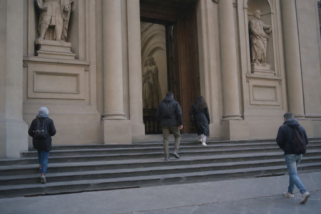 Early morning light falling across the empty entrance steps of the Accademia Gallery in Florence